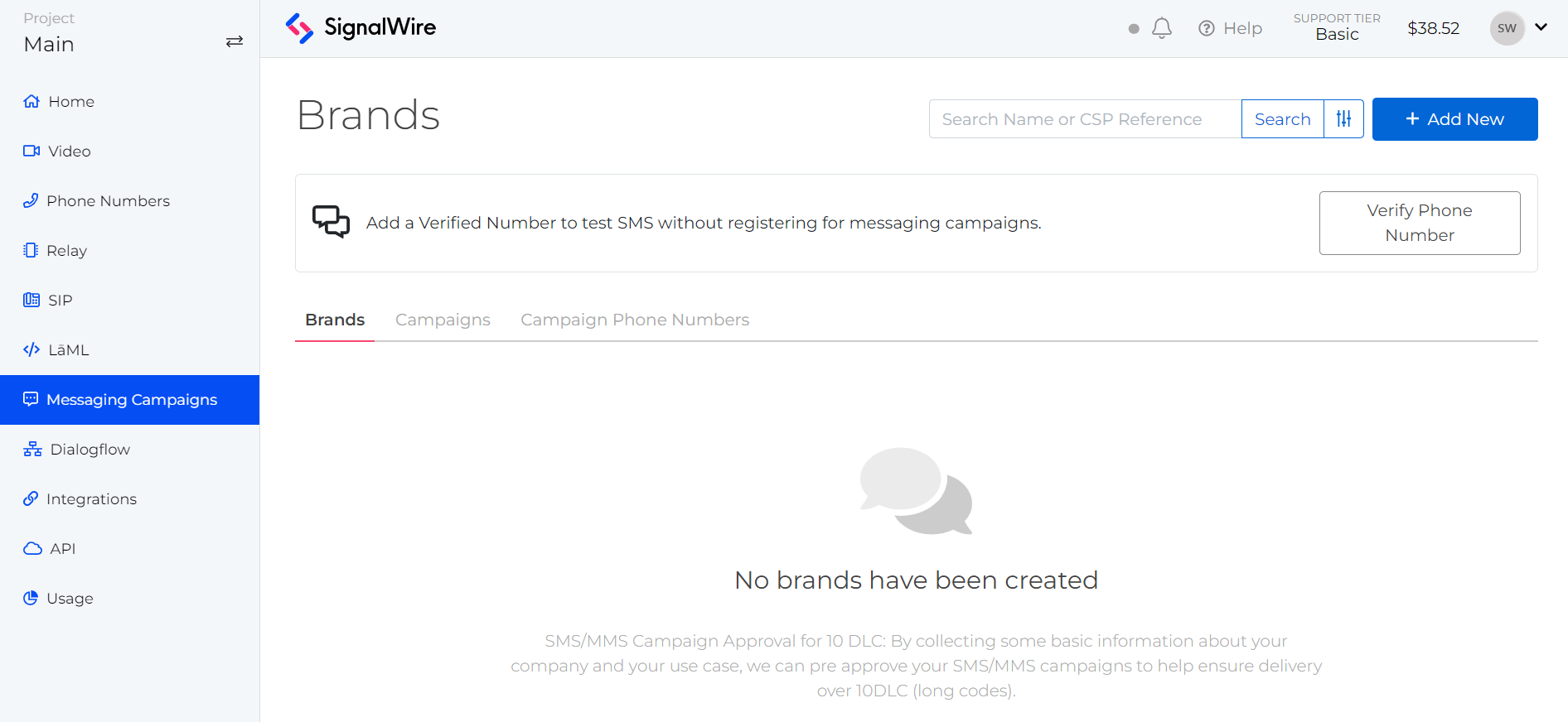 A screenshot of the Messaging Campaigns page in a SignalWire Space. The Brands tab is selected, and a dialog prompts the user to 'Add a Verified Number to test SMS without registering for messaging campaigns.'