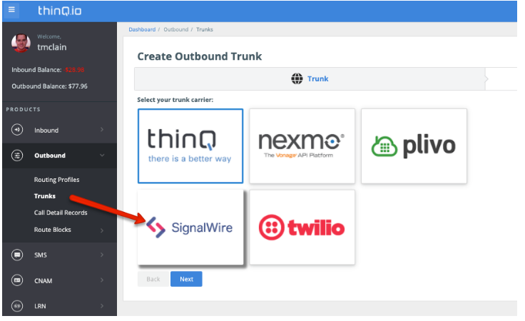 The Create Outbound Trunk page, with a red arrow pointing to the SignalWire logo