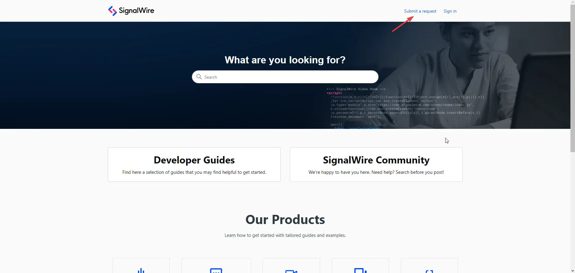 A screenshot of SignalWire's Support Portal, which has a search bar, Developer Guides, and a Community link. An arrow points to a link labeled 'Submit a request' in the top right.